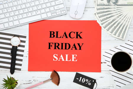 Text Black Friday Sale, keyboard, dollar banknotes and cup of coffee on wooden backgroundの写真素材