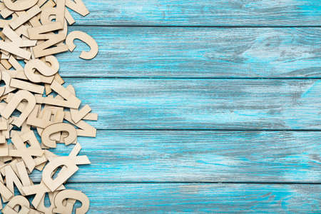 Wooden letters on blue table