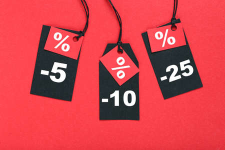 Sale tags with percents on red background