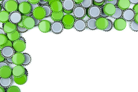 Green bottle caps on white background