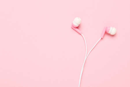 Earphones on the pink backgroundの写真素材