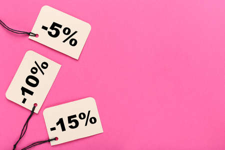 Sale tags with percents on pink backgroundの写真素材