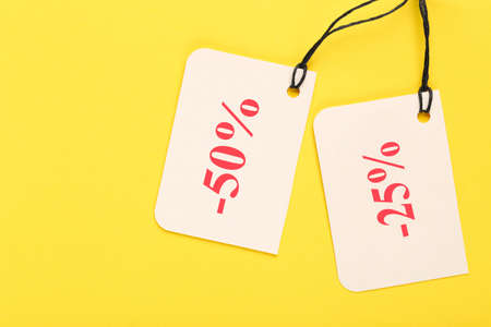 Sale tags on yellow background