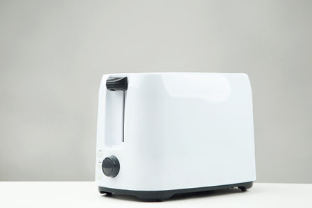 White toaster on gray background