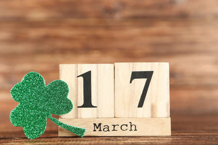 St. Patrick's Day. Cube calendar with clover leaf on wooden tableの写真素材