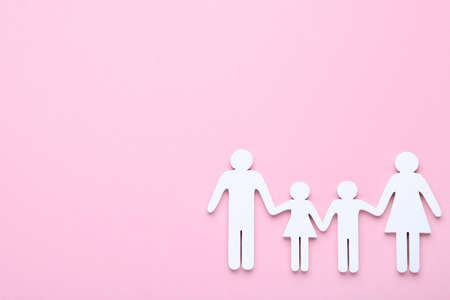 Family figures on pink backgroundの写真素材