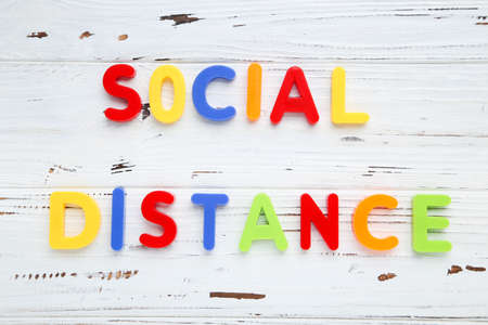 Inscription Social Distance on white wooden backgroundの写真素材