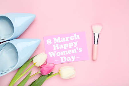 Tulip flowers and card with text 8 march Happy Womens Day, blue high heeled shoes and makeup brush...