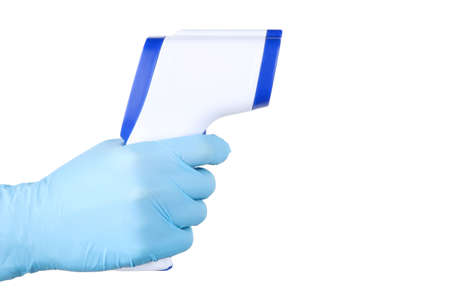 Medical infrared thermometer in doctor hand isolated on white background