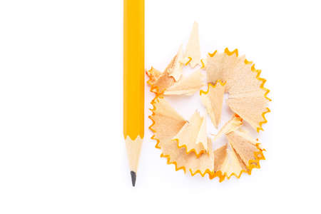 Yellow pencil with shavings on white background