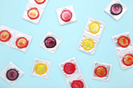 Colorful condoms on blue backgroundの写真素材
