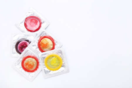 Colorful condoms on white backgroundの写真素材
