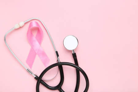 Cancer concept. Ribbon and stethoscope on pink backgroundの写真素材