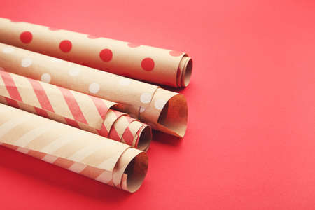 Rolls of craft papers on red backgroundの写真素材