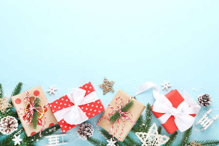 Gift boxes with ornaments on blue background