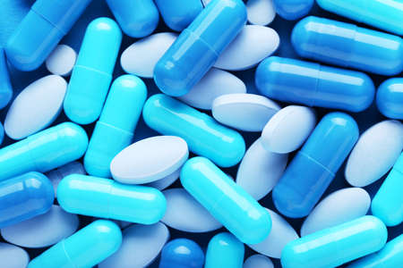 Background of blue pills and capsulesの写真素材