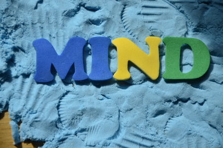 word mind on an abstract blue background.の写真素材