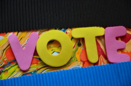 word vote on an abstract background