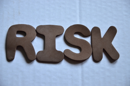 word risk on an abstract white backgroundの写真素材
