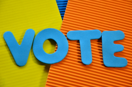 word vote on an abstractly colored background