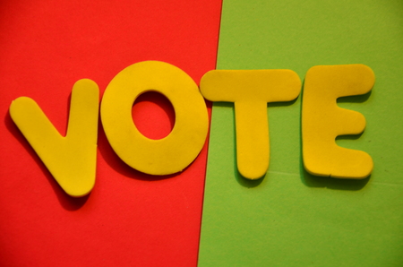 word vote on an abstract background