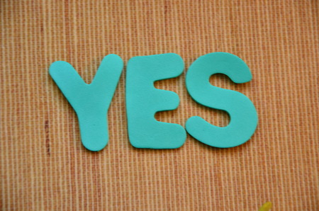 WORD YES on an abstract backgroundの写真素材