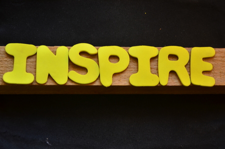 word inspire on an abstract backgroundの写真素材