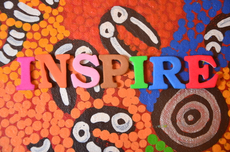 word inspire on an abstract backgroundの写真素材