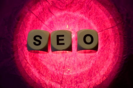 word seo on an abstract colored backgroundの写真素材