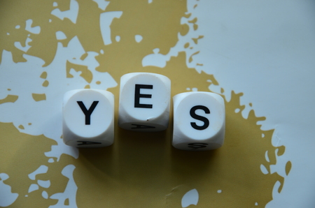WORD YES on an abstract backgroundの写真素材