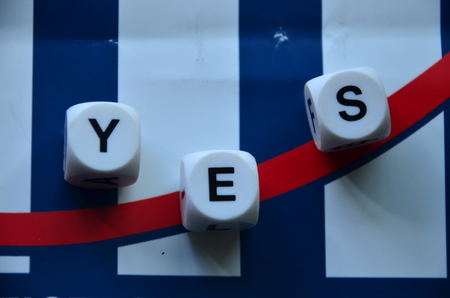 WORD YES on an abstract blue backgroundの写真素材