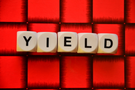 word yield on an abstractly colored backgroundの写真素材