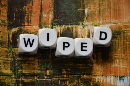 word wiped on an abstractly colored backgroundの写真素材