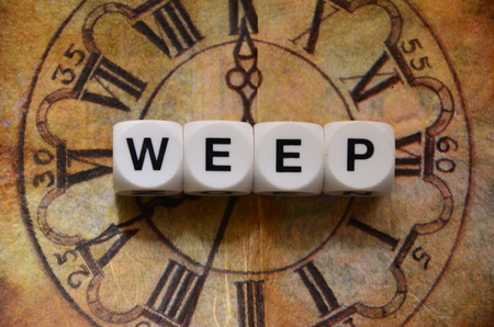 word weep on an abstractly colored backgroundの写真素材