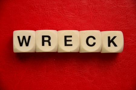 word wreck on an abstract red backgroundの写真素材