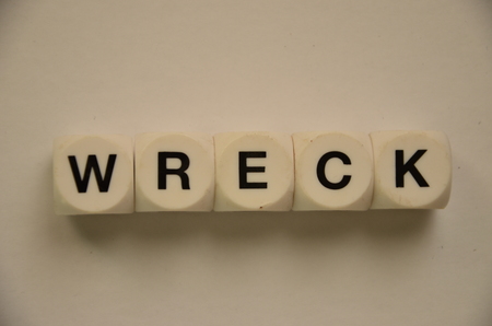 word wreck on an abstract white backgroundの写真素材