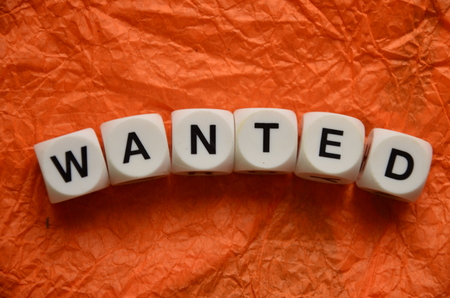 word wanted on an abstract backgroundの写真素材