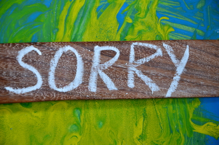word sorry on an abstract background