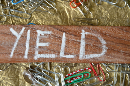 word yield on an abstract background