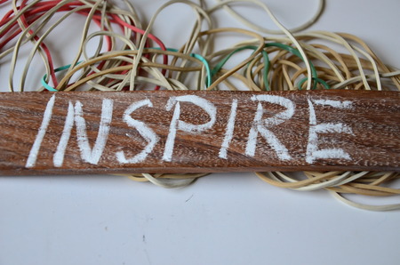 word inspire on an abstract backgroundの写真素材