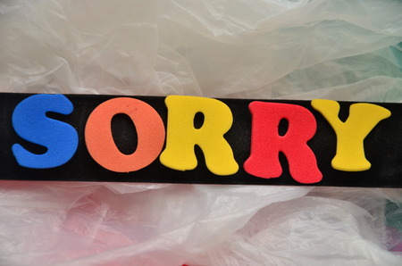 word sorry on an abstract backgroundの写真素材