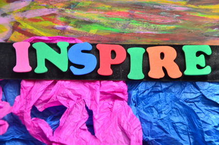 word inspire on an abstract backgroundの写真素材