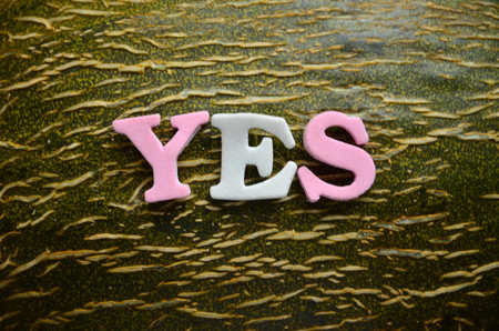 WORD YES on an abstract backgroundの写真素材