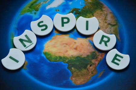 Word inspire on an abstract background