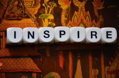 word inspire on an abstractbbackground