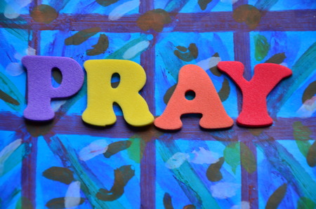 Word pray on an abstract backgroundの写真素材