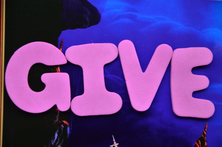 Word give on an abstract background