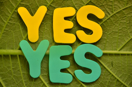 Word yes on an abstract backgroundの写真素材
