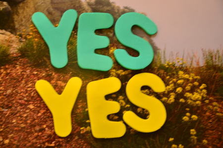 Word yes on an abstract backgroundの写真素材