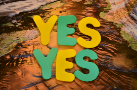 Word yes on an abstract backgroundの写真素材